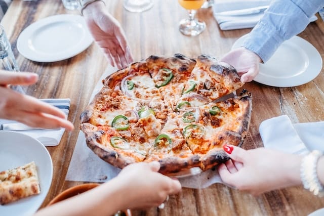 Pizza in a famous pizzeria which is one of the best places for foodies to visit in Rome