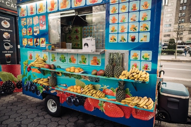 Food truck with fruit as an example of New York's varied food truck scene.